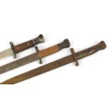 Three military interest bayonets, each approximately 42.5cm in length :For Further Condition Reports