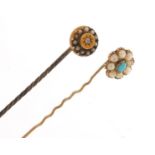 Two Victorian unmarked gold tie pins set with seed pearls, diamond and turquoise, the largest 6cm in