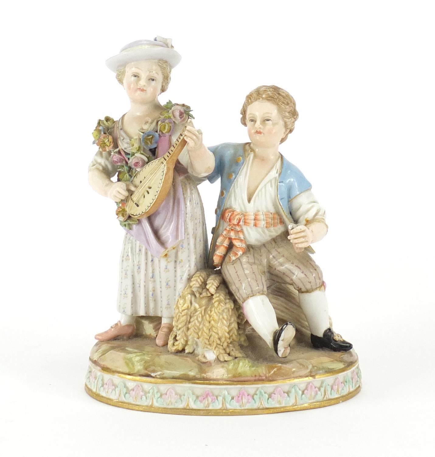 19th century Meissen figure group of a boy and girl playing a mandolin, blue cross sword marks and