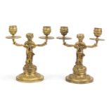 Pair of gilt bronze pan design two branch candlesticks, each 19.5cm high : For Condition Reports