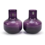 Pair of Whitefriars mallet shaped amethyst glass vases with paper labels, each 17cm high : For