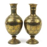 Large pair of Indian brass vases engraved with figures, animals and flowers, each 53cm high : For