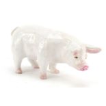White glazed pottery pig, possibly Scottish, indistinctly inscribed to one foot, 18.5cm in