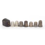 Seven Victorian and later silver thimbles, one with a Sidney Smith leather case, various