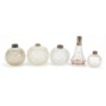 Five cut glass scent bottles, four with silver collars, the largest 14.5cm high : For Further