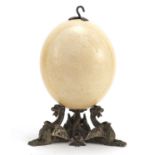Australian carved emu egg on silver plated griffin stand, 21.5cm high : For Further Condition