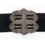 Persian velvet belt with silver coloured metal two piece buckle engraved with flowers and mythical