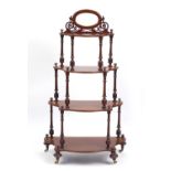 Victorian mahogany serpentine front four tier wotnot with mirrored back, 132cm H x 76cm W x 38cm D :