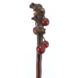 Early 20th century parasol with naturalistic Chinese handle finely carved with cherries, 91cm in