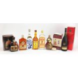 Seven bottles of alcohol including Remy Martin Cognac, Hein Cognac, Gordons Gin and four Bells Rum :