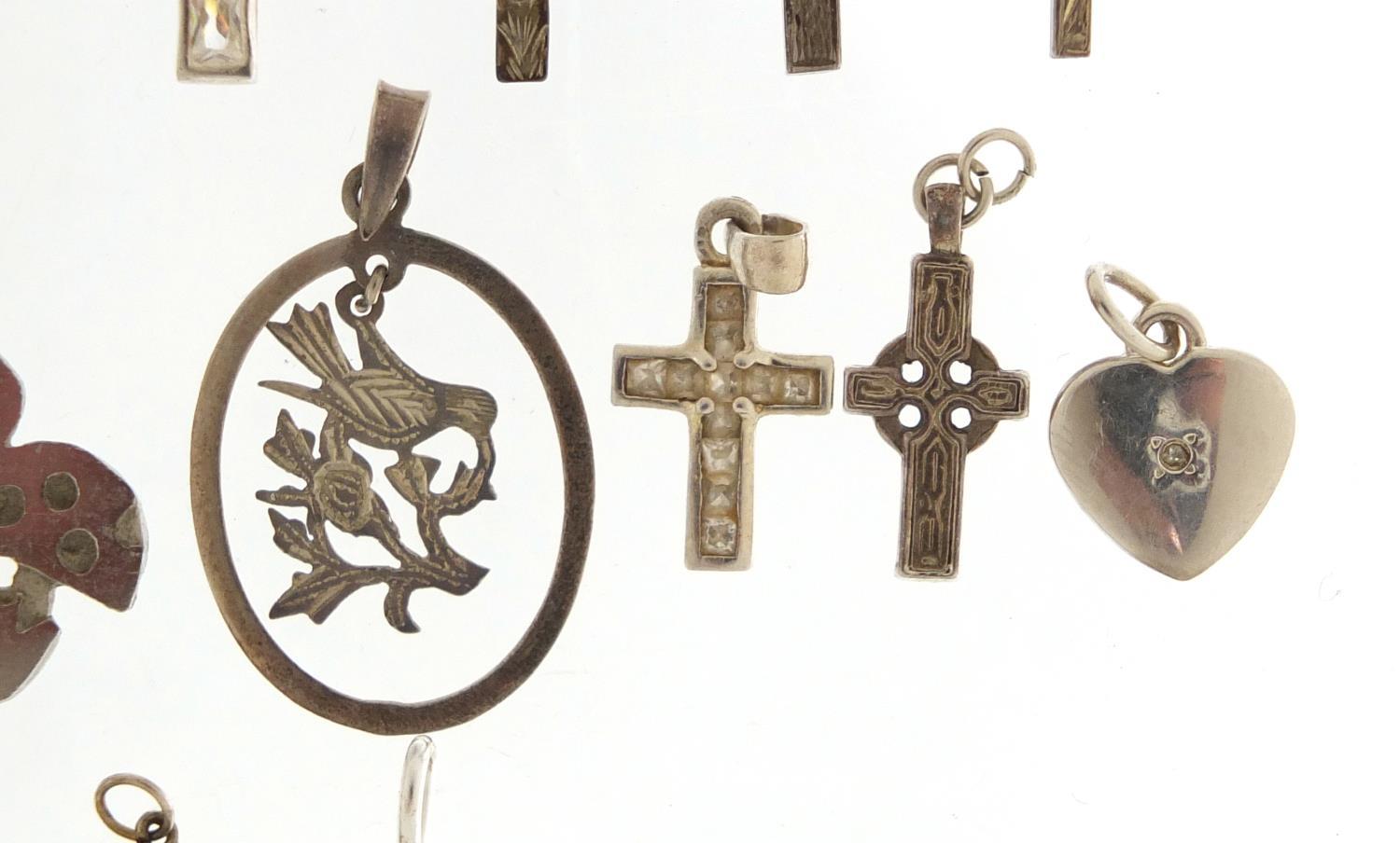Twenty two silver pendants including crucifixes and love hearts, the largest 5.5cm in length, 39. - Image 5 of 8