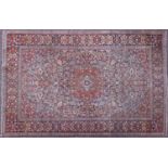 Rectangular Persian Kashan rug having all over floral design onto midnight blue and red grounds,
