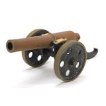 Cast iron and bronzed table cannon, 32cm in length : For Further Condition Reports Please Visit