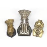 Three 19th century letter clips including two in the form of a hand, the largest 14.5cm in