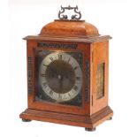 19th century birds eye maple bracket clock with brass face and silvered chapter ring having Roman