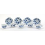 Five Meissen demitasse cups and four saucers, each hand painted in the Blue Onion pattern, crossed