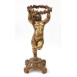 Large floor standing gilt figure of Putti, 105cm high : For Further Condition Reports Please Visit