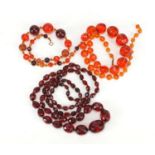 Three amber coloured faceted bead necklaces, the largest 100cm in length, 169.0g : For Further