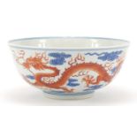 Chinese iron red and blue and white porcelain bowl, finely hand painted with two dragons chasing a