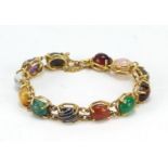 Good 18ct gold bracelet set with symmetrical cabochon semi precious stones including quartz,