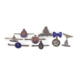 Eight silver and enamel British military brooches including Royal Engineers, the largest 5cm wide,