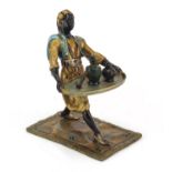 Cold painted bronze of an Arab holding a tray in the style of Franz Xaver Bergmann, 10.5cm high :