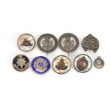 Seven British Military silver brooches and a pendant including two Services Rendered, three with