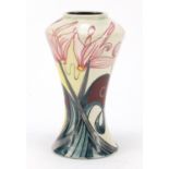 Black Ryden vase hand painted with stylised flowers, impressed marks and painted initials to the