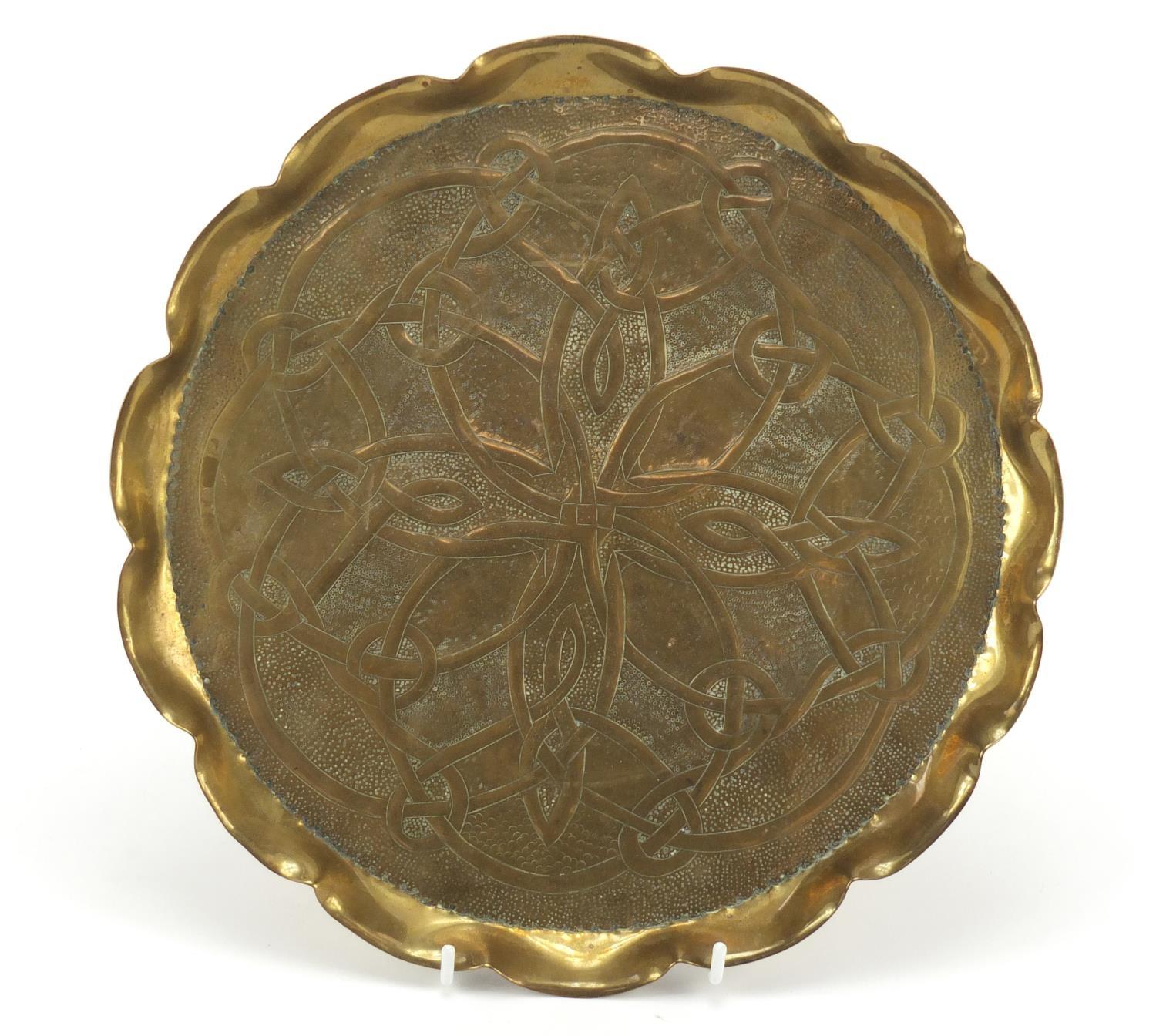 Arts & Crafts brass tray embossed with foliate motifs, 28cm in diameter : For Further Condition