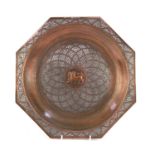 Burmese copper tray embossed with a mythical dragon and having silver foliate overlay, 35cm high :