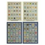 Four framed displays of Whitbread in advertising trade cards including the complete first series,