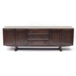 Ercol elm sideboard fitted with three drawers and four cupboard doors, 74cm H x 218cm W x 43cm D :
