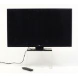 Bush 32 inch LCD TV with remote : For Further Condition Reports Please Visit Our Website, Updated