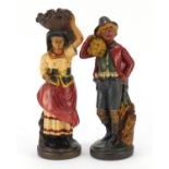 Pair of hand painted plaster figures of farmers, the largest 29.5cm high : For Further Condition