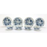 Four Meissen cups and saucers hand painted in the blue onion pattern, crossed sword marks to the