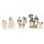 Victorian Staffordshire flat back figures and spill vases including Saint George & The Dragon, the