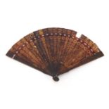 Chinese Canton tortoiseshell brisé fan, finely carved with panels of pagodas amongst flowers and