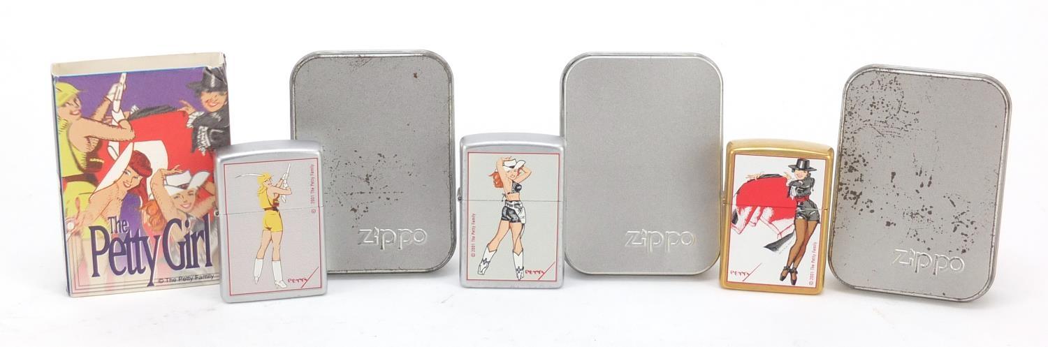 Three Zippo Petty Girl lighters two with cases including one with cardboard slip : For Further