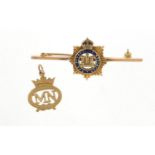 Military interest 9ct gold and enamel "The Devonshire Regiment" brooch and an MN pendant, the brooch