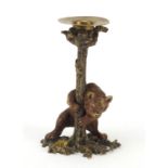 Cold painted bronze candlestick in the form of a bear hugging a trunk in the style of Franz Xaver
