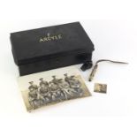 Military interest Argyle items comprising a black painted mess tin, two black and white photographs,