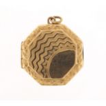 9ct gold back and front octagonal locket with engine turned decoration, 2.2cm in diameter, 4.3g :