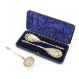 Pair of Victorian silver plated apostle spoons with gilt interiors and a similar sifting spoon,