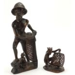 Two well carved Indonesian hardwood figures including a fishermen, the smallest signed to the