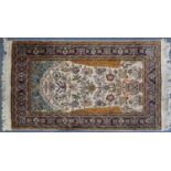 Rectangular Persian Qum silk rug having an all over floral design, 160cm x 91cm : For Further