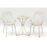 Wrought iron garden table and two chairs, the table 72cm high x 53cm in diameter : For Further