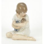 Royal Copenhagen figurine of a girl holding a doll, numbered 1938, 13cm high : For Further Condition