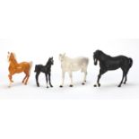 Three collectable horses and a foal comprising two Royal Doulton and two Beswick, the largest 25cm