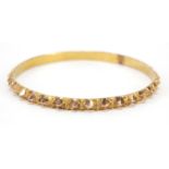 Unmarked gold bangle, (tests as 9ct gold) 6.5cm in diameter, 18.4g : For Further Condition Reports