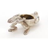 Novelty silver plated salt with gilt interior in the form of a frog pulling a snail shell, 10cm in